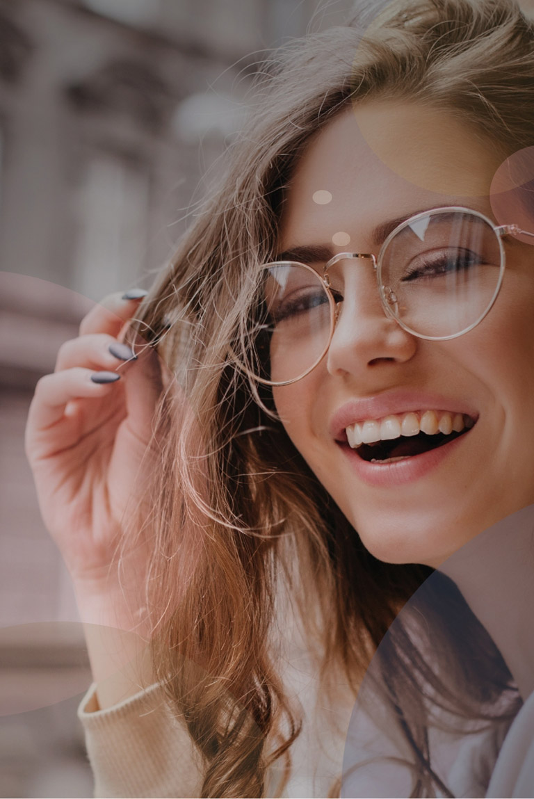Smiling Woman in Glasses Showcasing Teeth Whitening